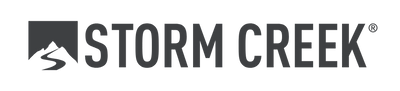 The storm creek logo is black and white with a mountain in the background.