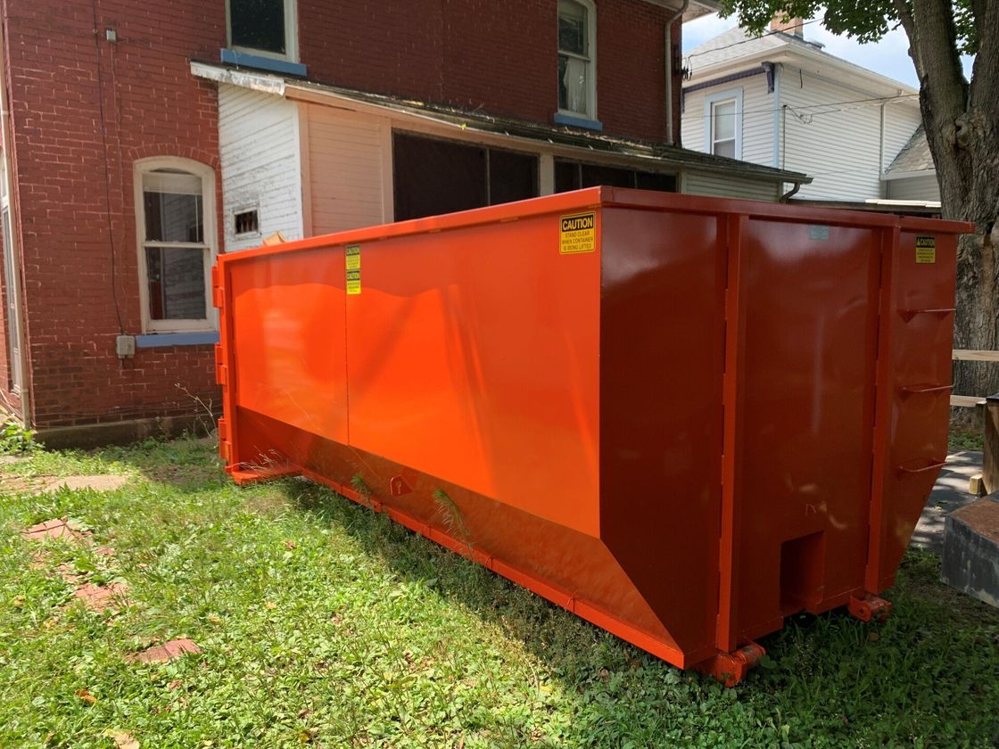 Orange Dumpster — Lancaster, OH — League Dumpster Rental LLC