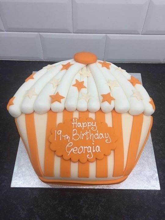 Orange striped cupcake shaped 19th birthday cake