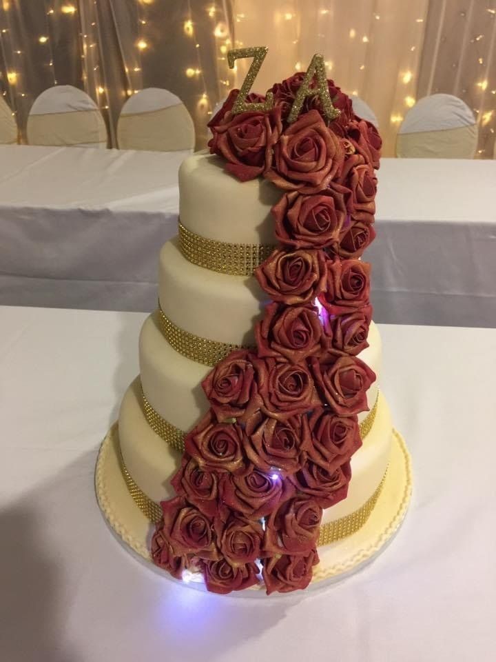 4 tier wedding cake with waterfall of roses