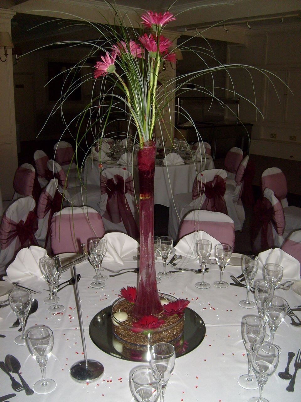 table setting with pink themed chair covers
