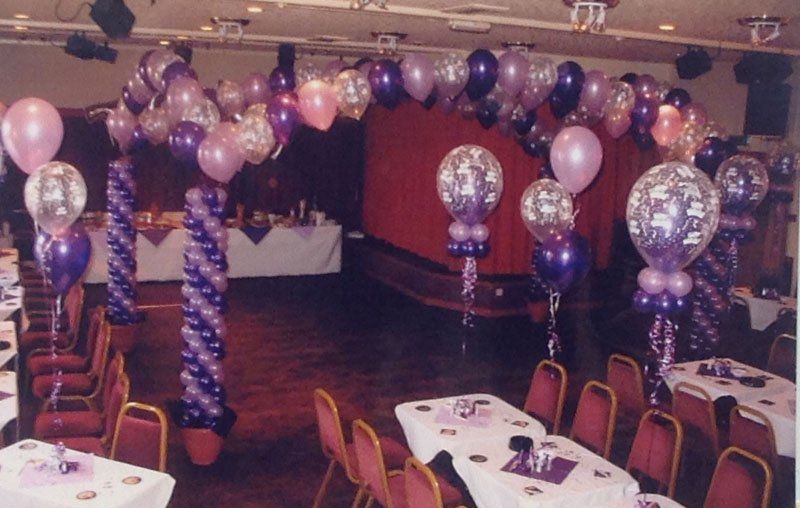purple themed balloon arches