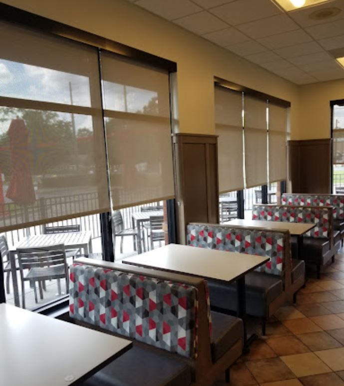 A row of tables and booths in a restaurant