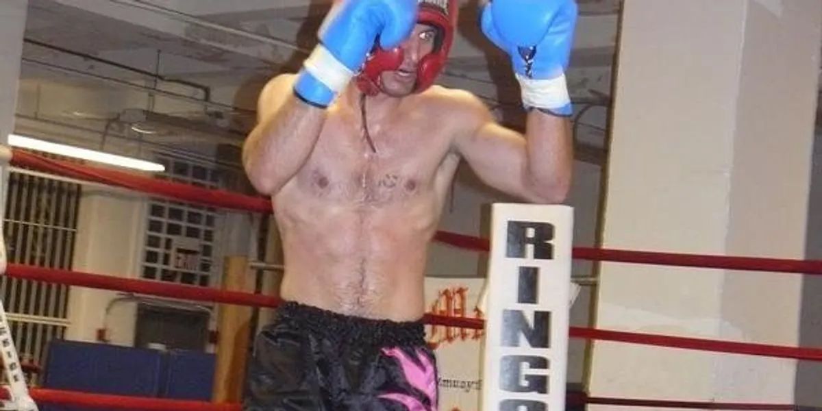 A boxer in a ring with a sign that says ring on it