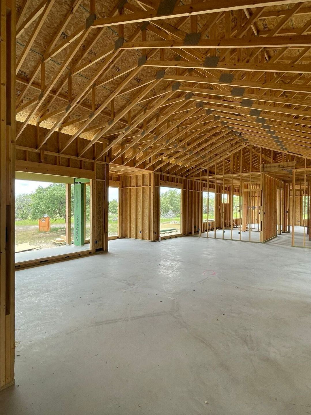 The inside of a building under construction with a lot of windows.