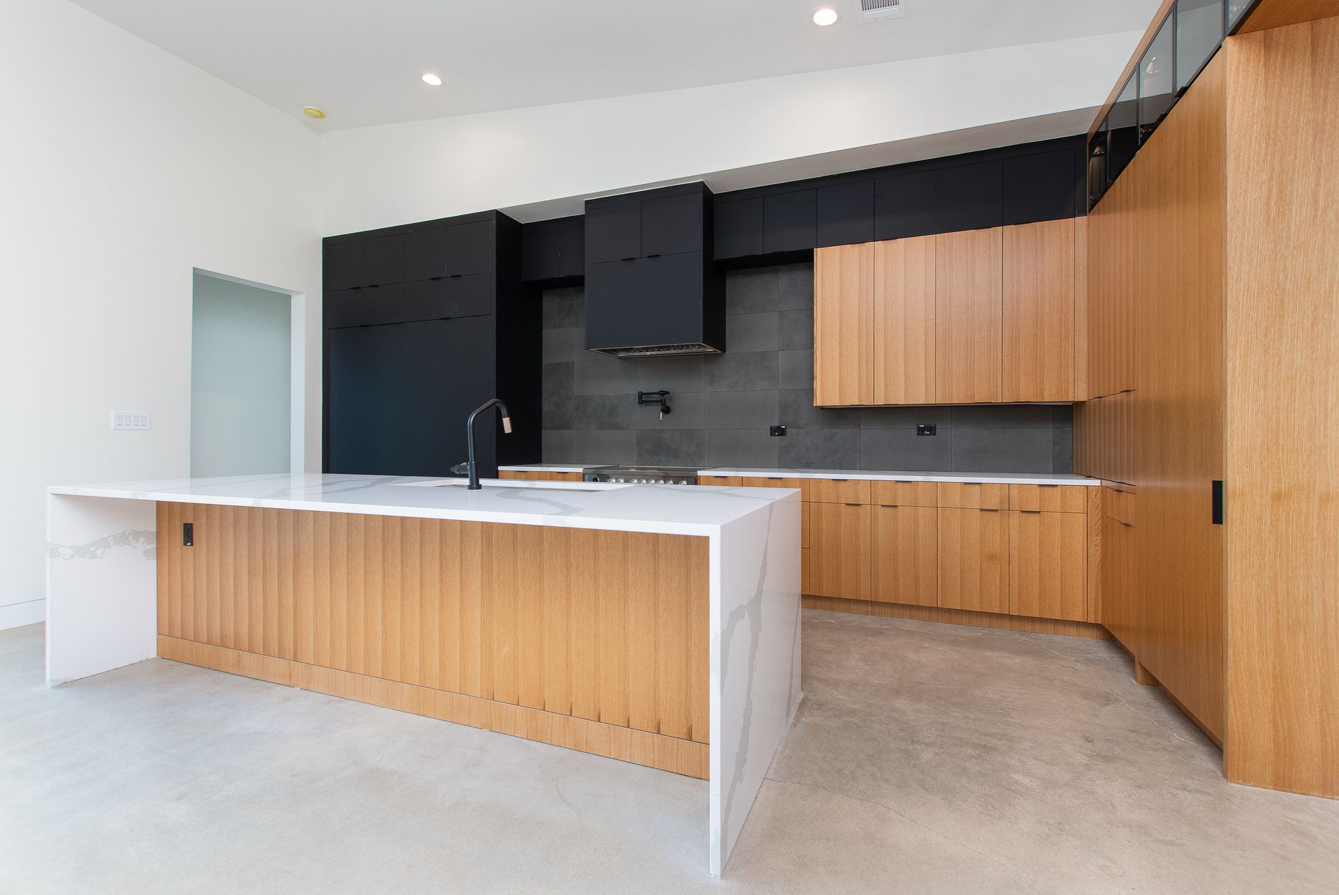 There is a large island in the middle of the kitchen.