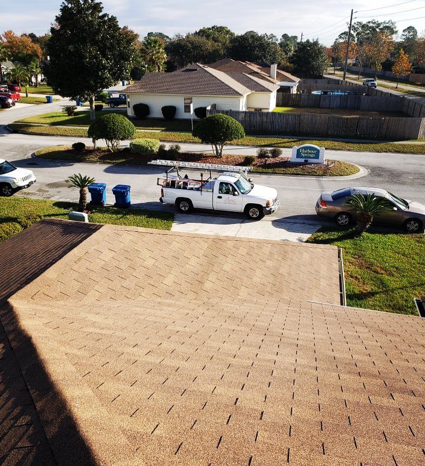 An aerial view of a roof with a window on it.