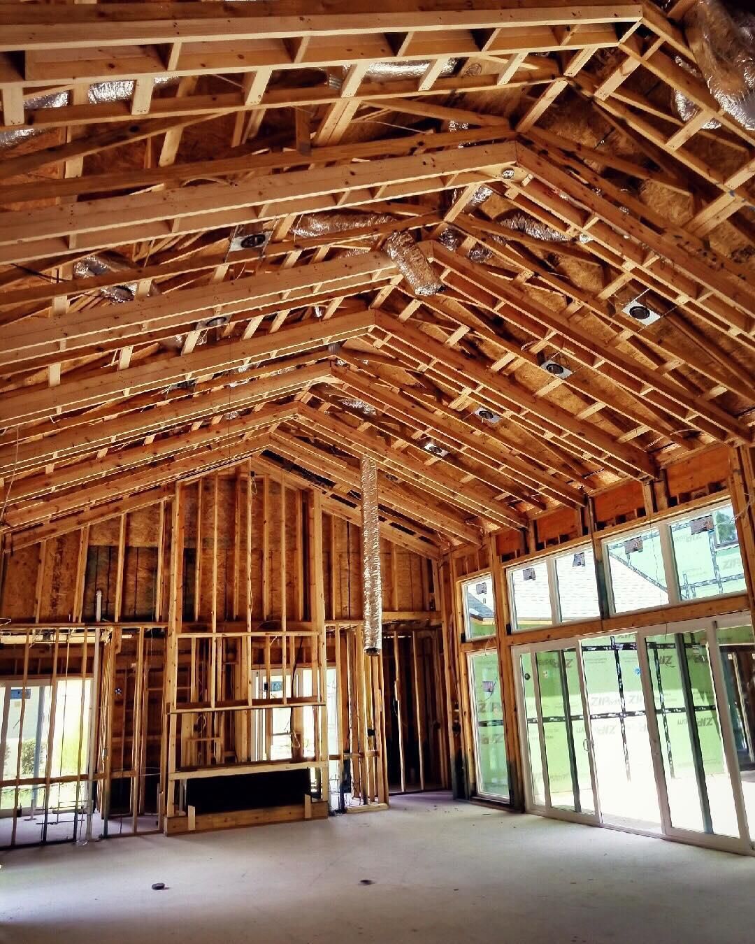 The inside of a building under construction with a lot of windows