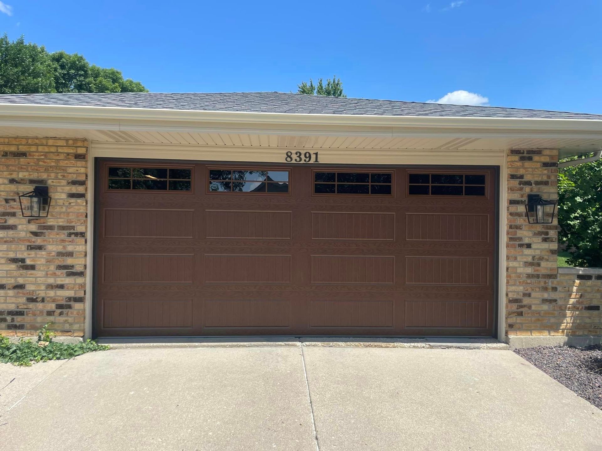 new brown garage door with windows