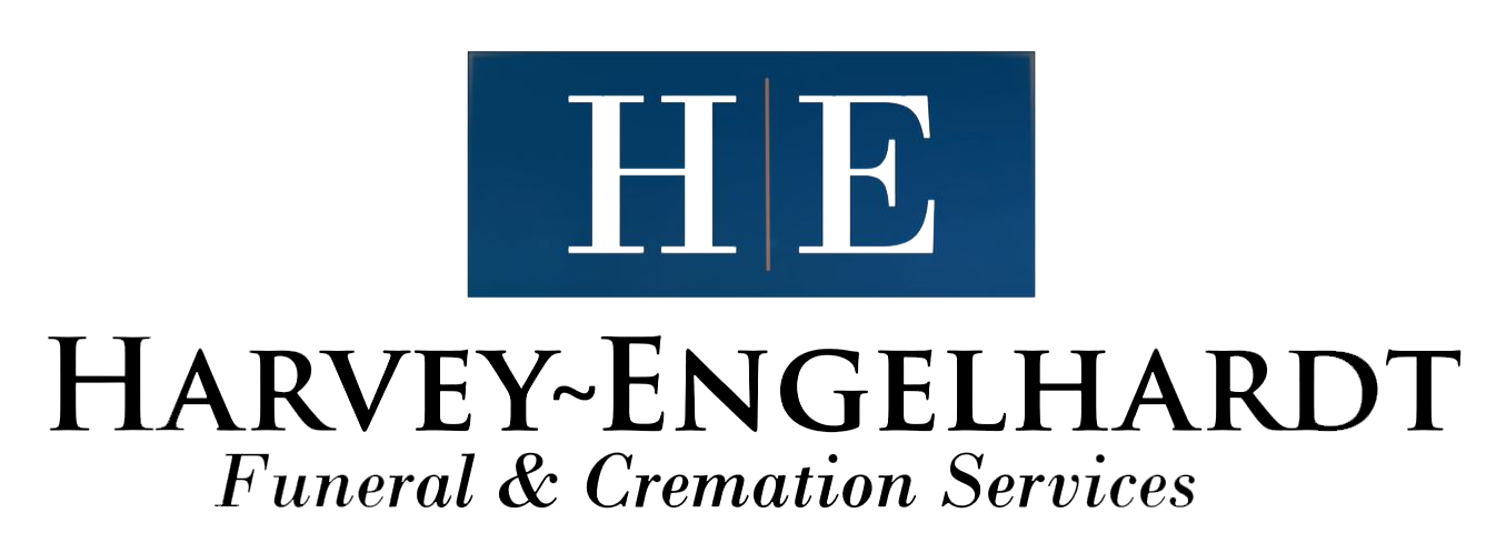 Logo for Harvey-Engelhardt Funeral & Cremation Services: blue square with white HE, black text below.