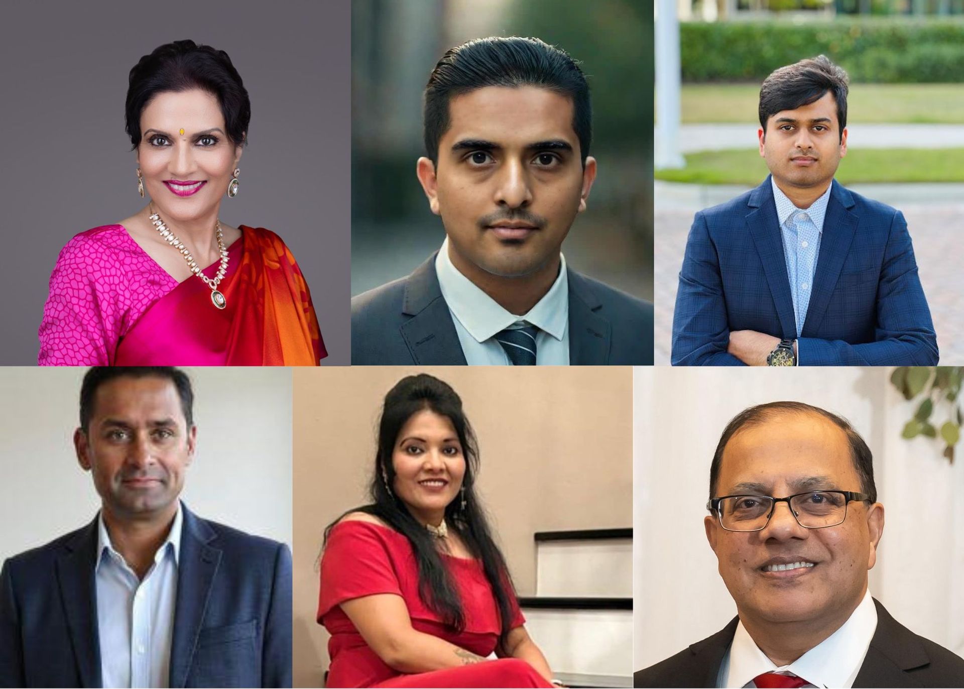 A group of people are posing for a picture in front of a decoration.