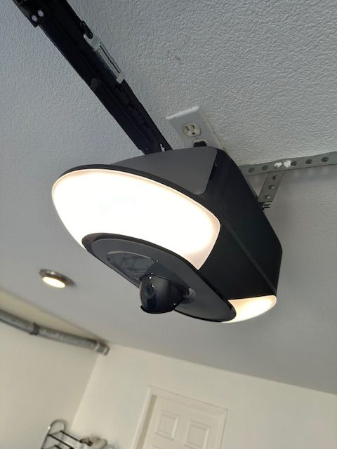 A garage door opener with a light attached to it