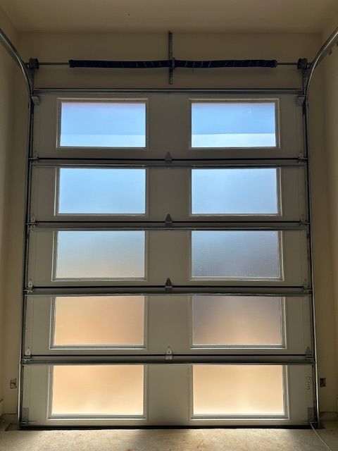 A garage door with a lot of windows on it