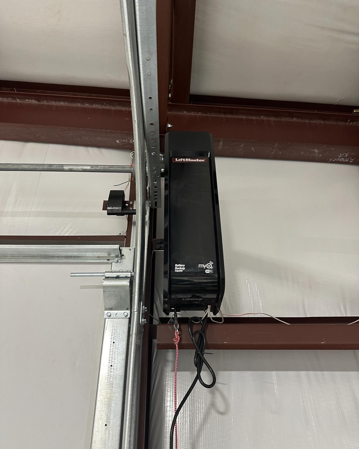 A close up of a garage door opener in a garage.