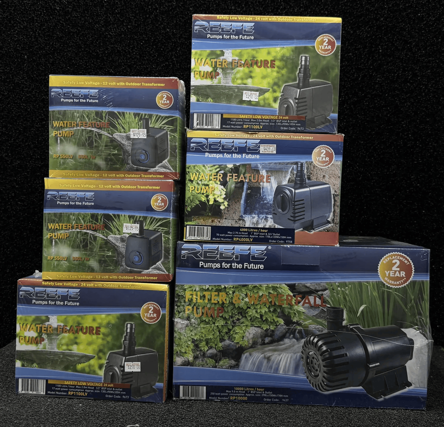 Stack of Boxed Water Feature Pumps, Black with Colorful Packaging — Summerland Aquarium in Wollongbar, NSW