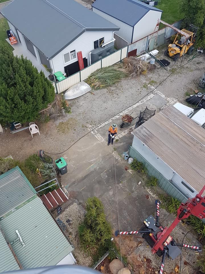 An aerial view of a construction site with buildings and machinery.