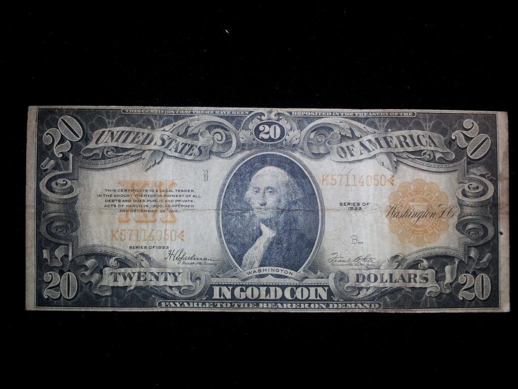 A twenty dollar bill with a picture of george washington on it.