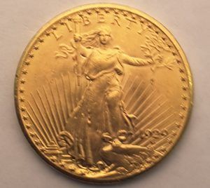 A gold coin that says liberty on it.