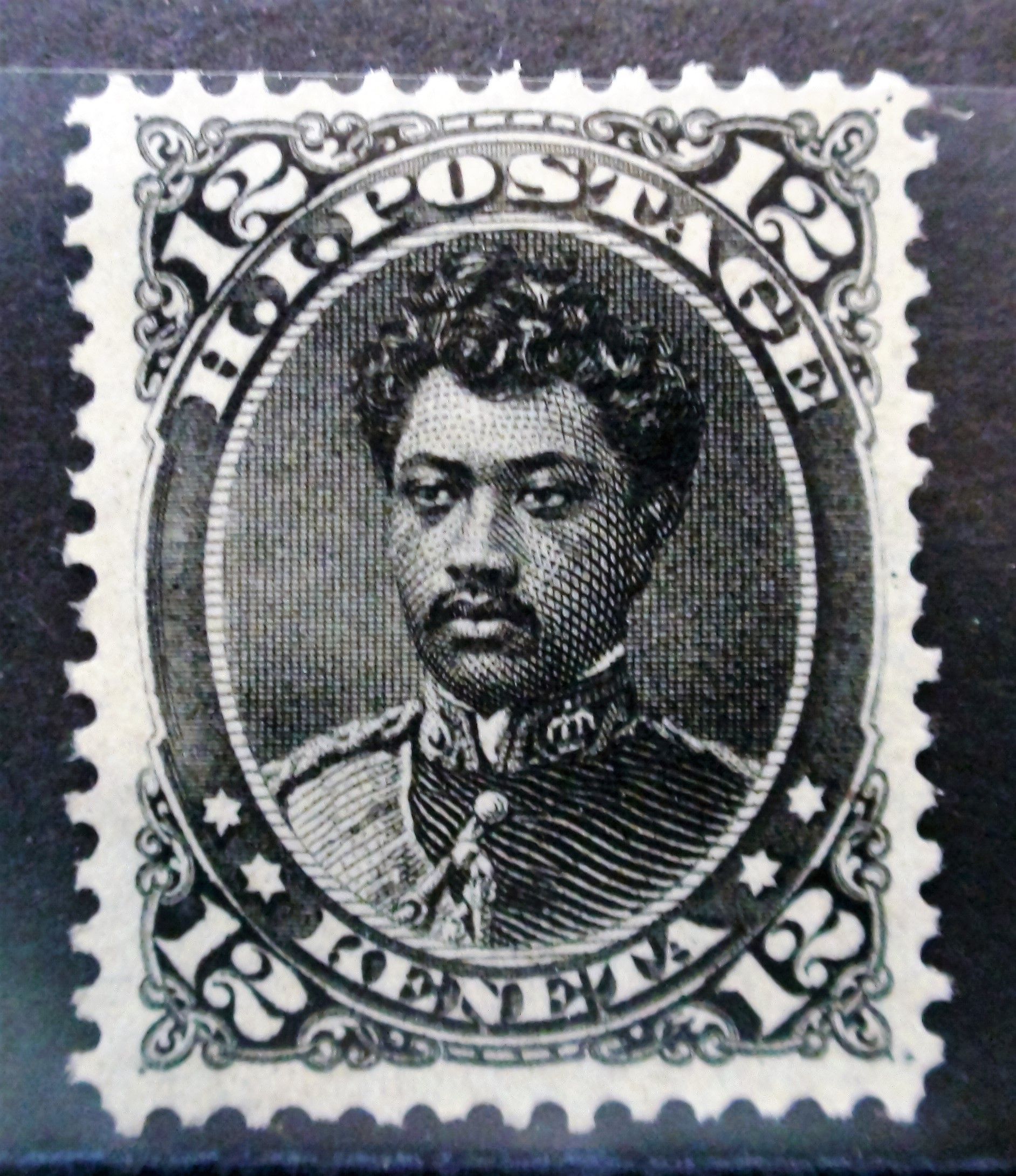 A black and white postage stamp with a picture of a man.