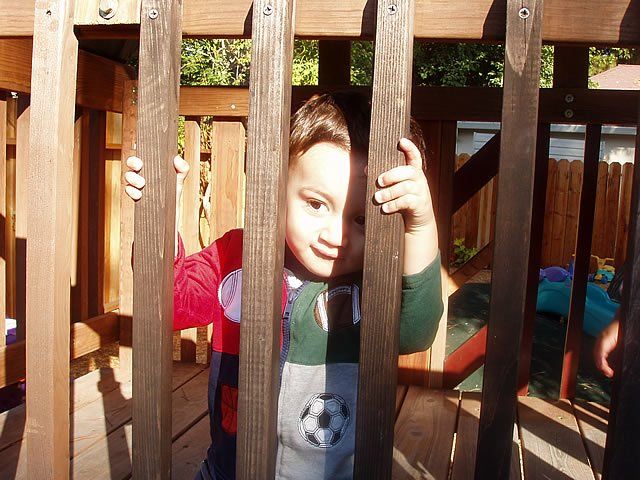 Little boy behind wooden bars - My Second Home - Concord, CA