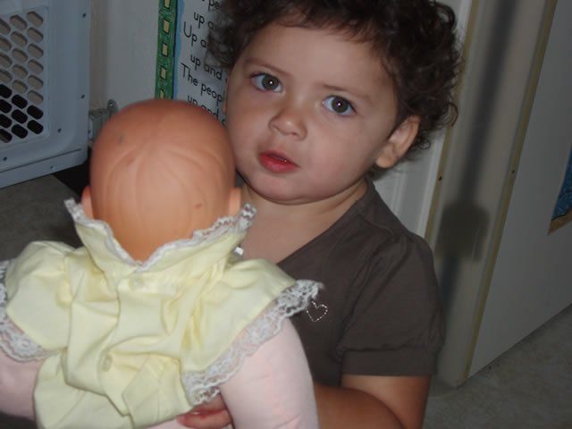Toddler holding baby doll - My Second Home - Concord, CA
