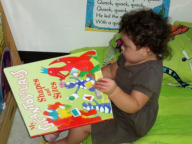 Little girl reading book - My Second Home - Concord, CA