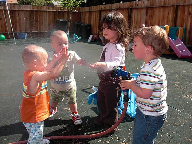 Little children playing with spray water - My Second Home - Concord, CA