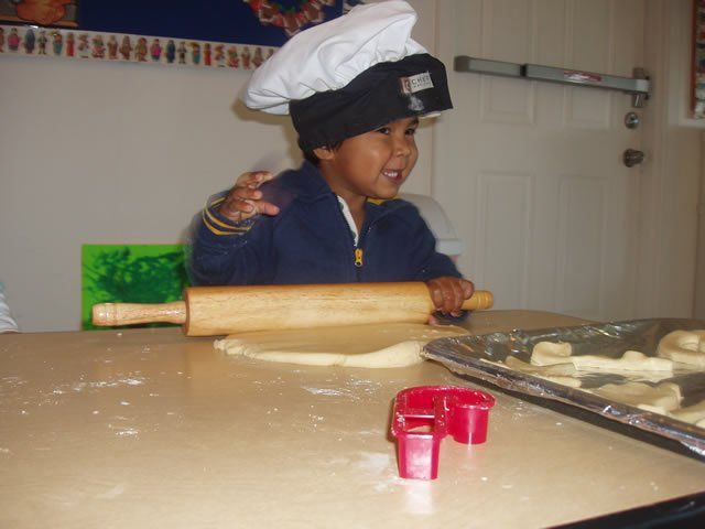 Child rolling pizza dough - My Second Home - Concord, CA