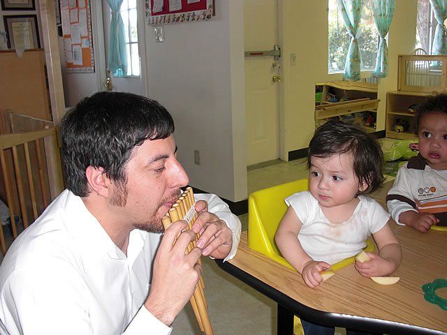 Teacher playing bamboo pan flute - My Second Home - Concord, CA