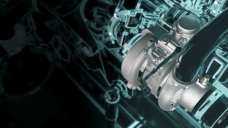 A close up of a turbocharger on a black background.