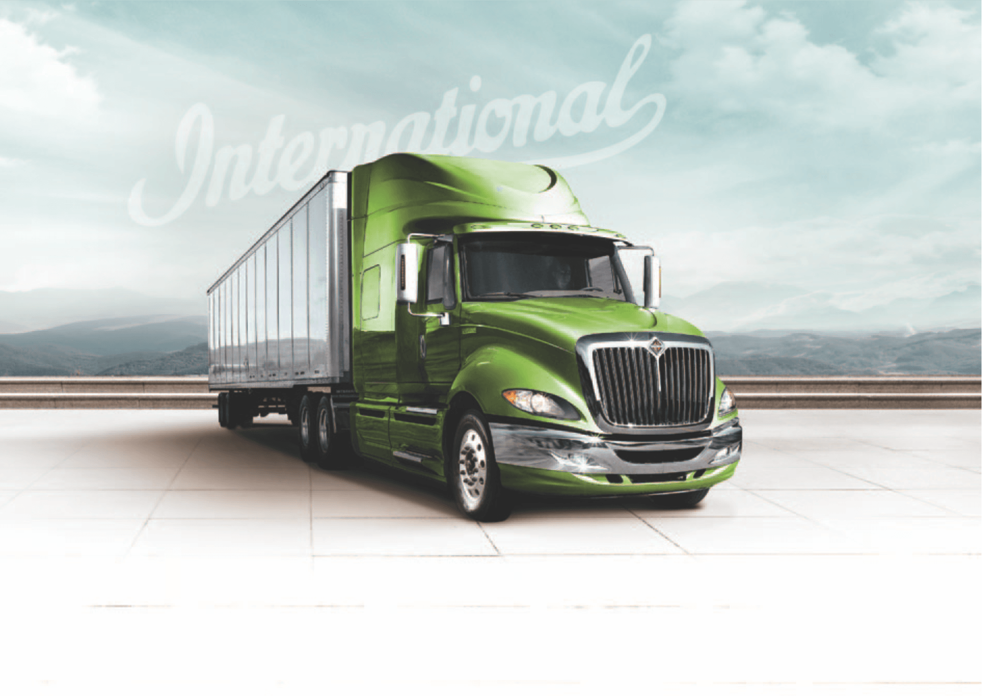 A green semi truck is parked on the side of the road.