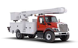 A red and white utility truck with a bucket on top of it.