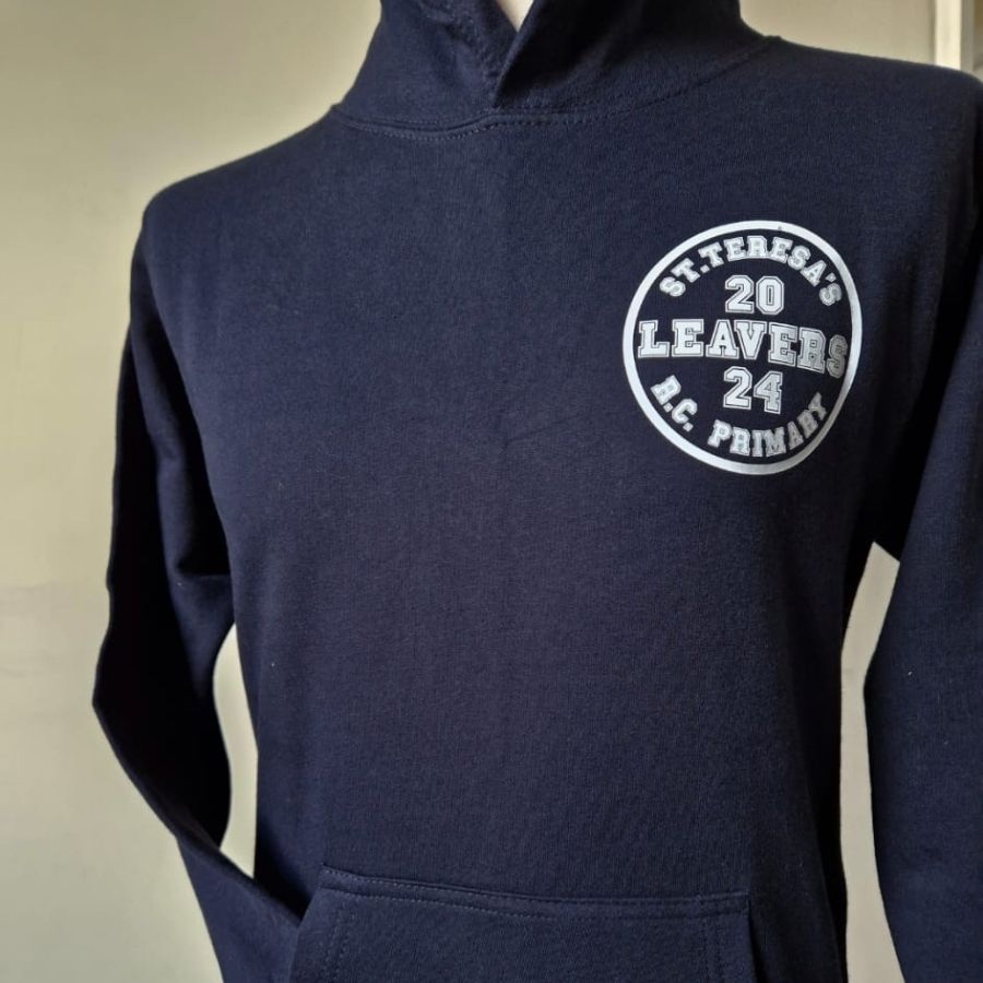 A person wearing a hoodie that says st. teresa 's 20 leaver a.c. primary