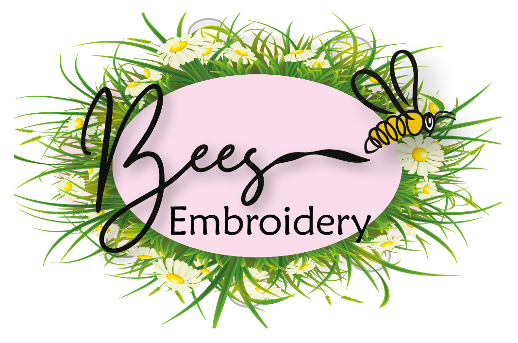 The logo for bees embroidery is surrounded by daisies and grass.