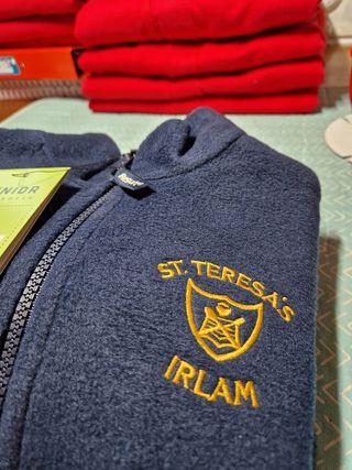 A blue sweatshirt with the name irlam embroidered on it