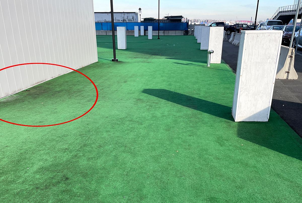 stained or burned artificial turf in need of repair