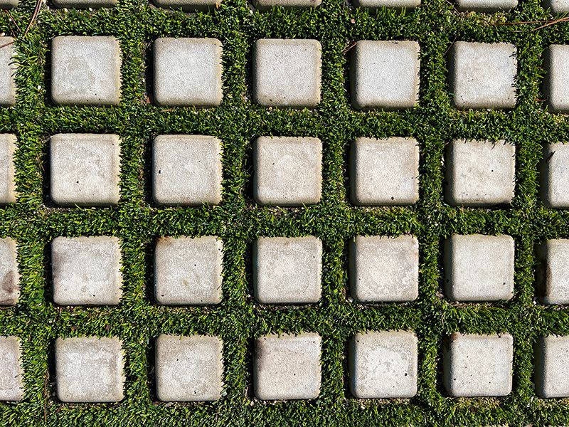 2 inch square stone pattern among turf roll on Davis Island project