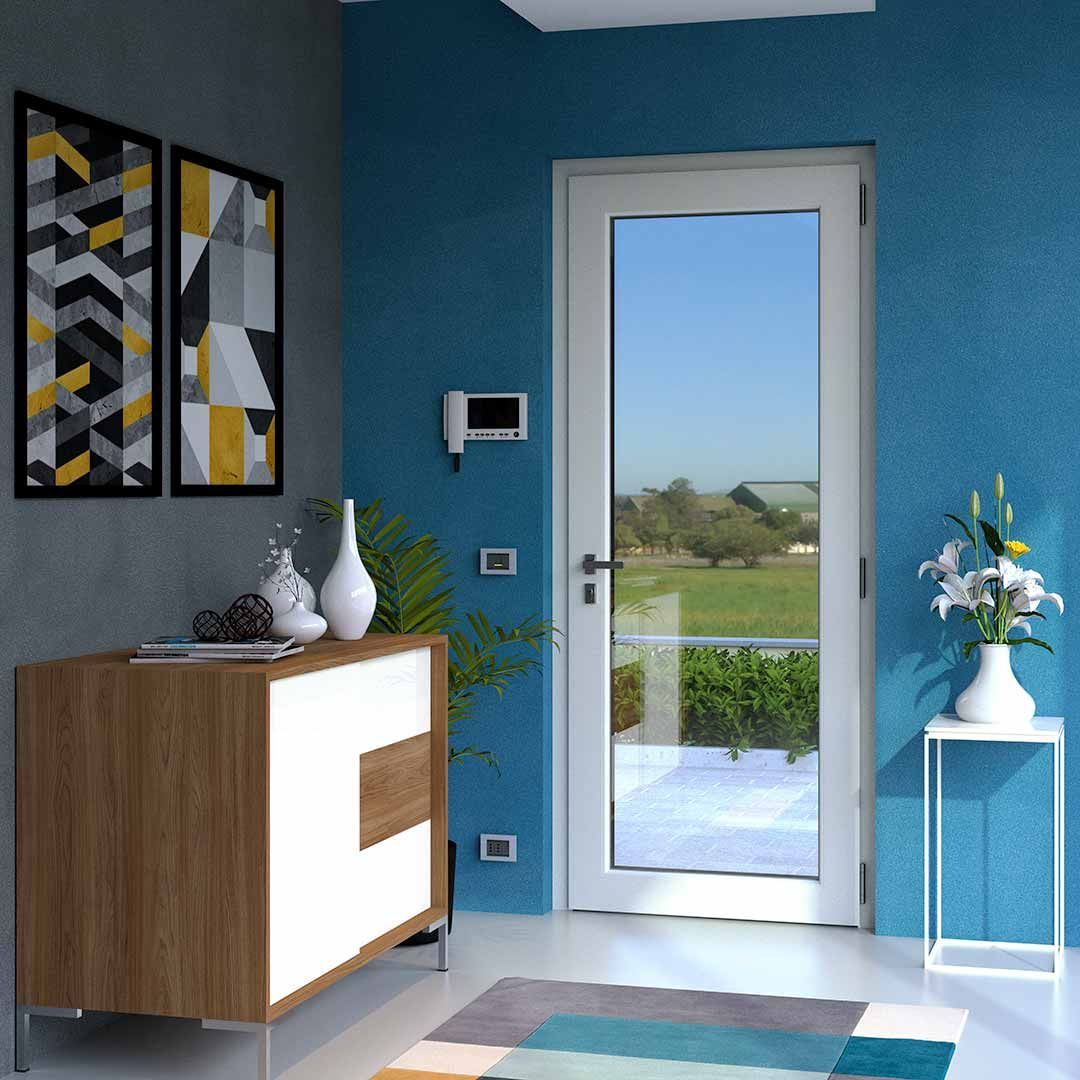 Una stanza con pareti blu e una porta bianca