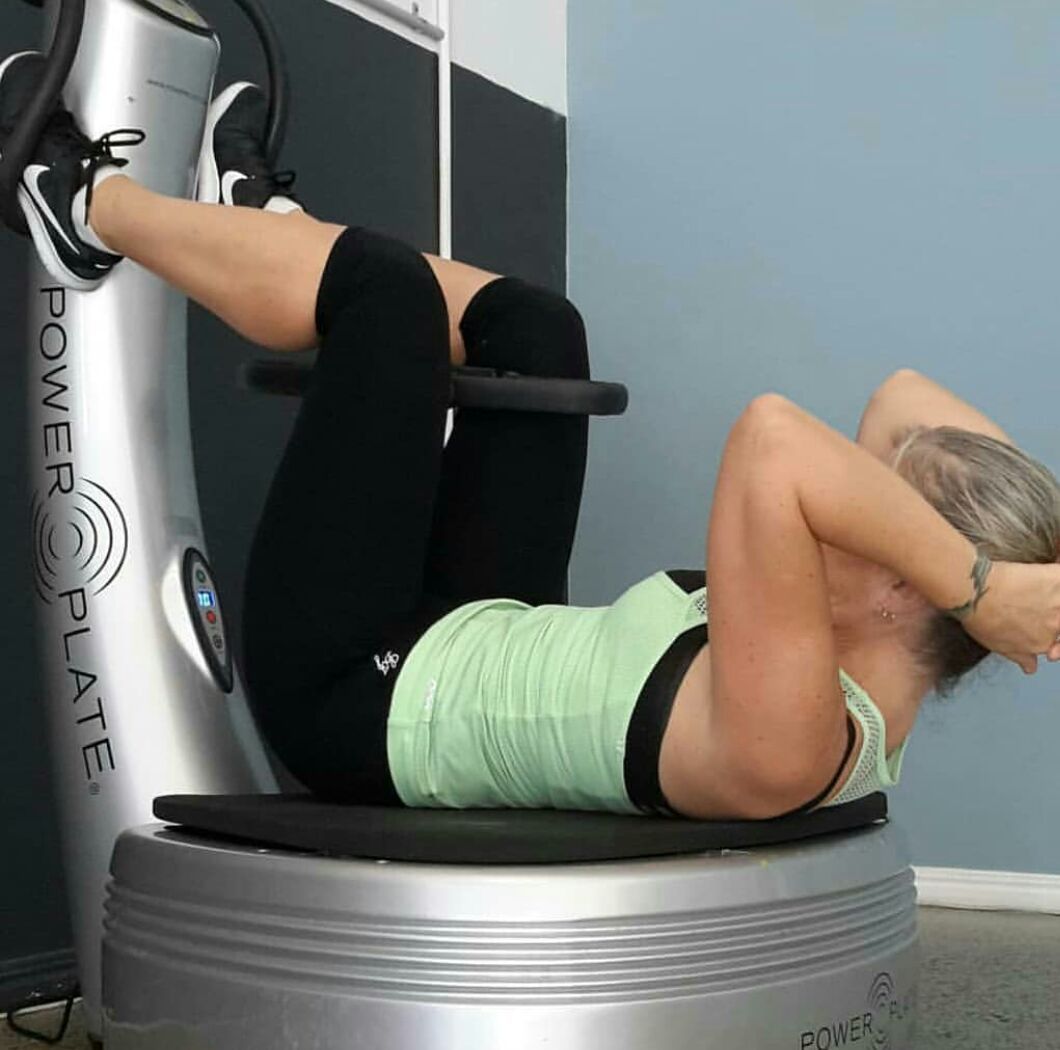 Woman Doing Exercise On A Power Plate — Power Plate Studio Noosa in Noosaville, QLD