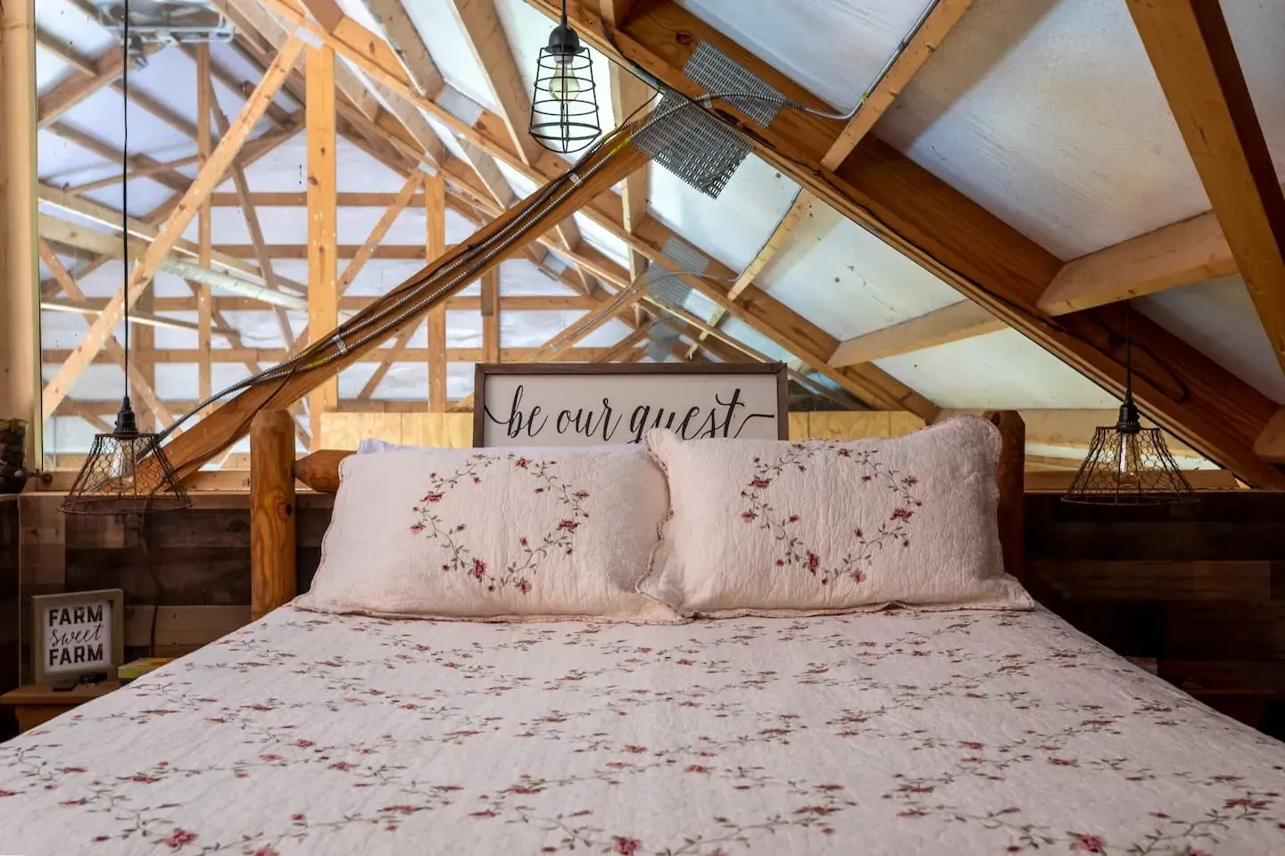 There is a bed in the attic with a sign that says `` be our guest ''.