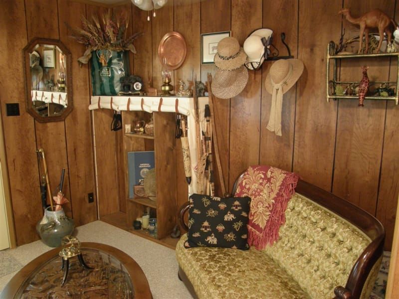 A living room with a couch and a fireplace