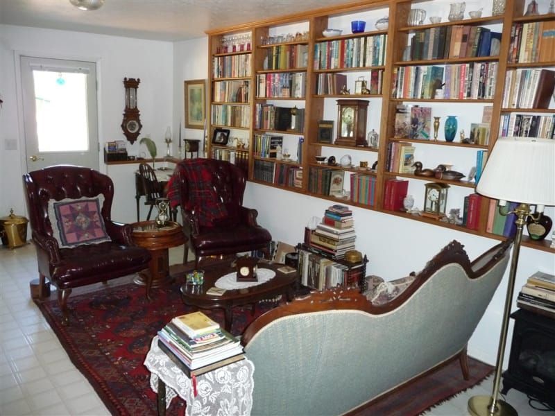 A living room filled with furniture and bookshelves