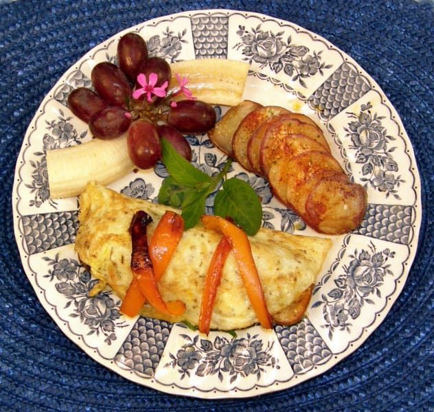 A blue and white plate with food on it
