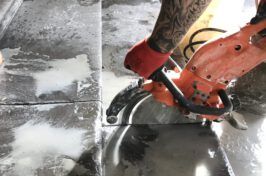 A person is cutting a tile with a circular saw.