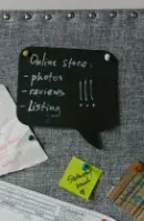 Gray bulletin board with notes: