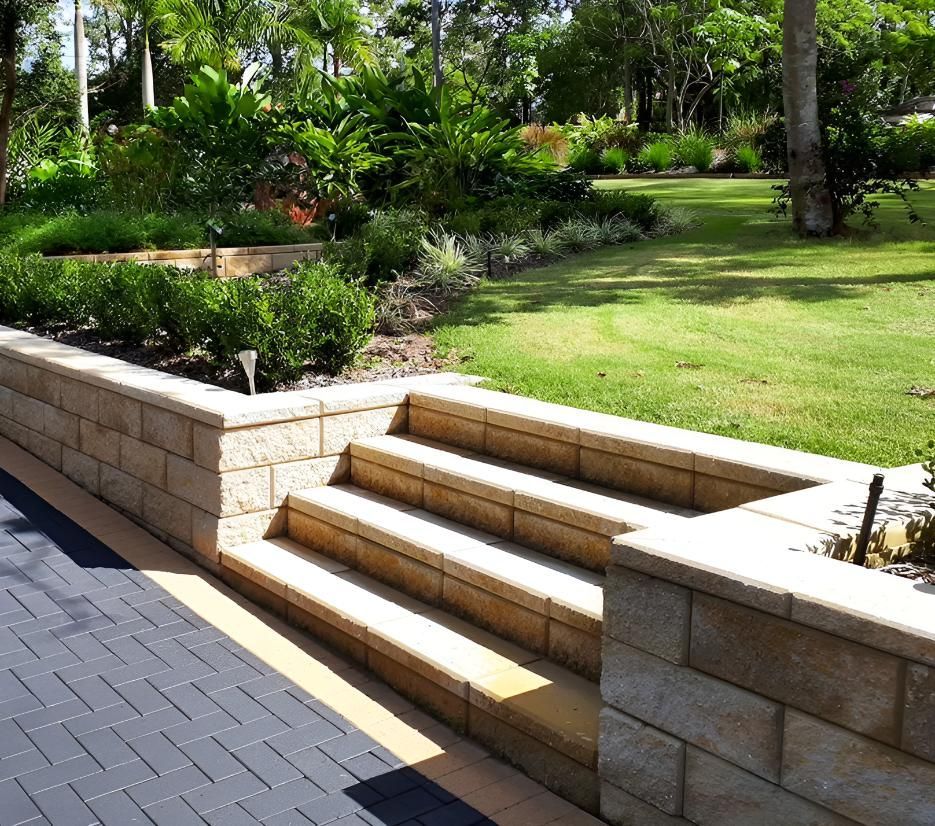 A Brick Wall With Steps Leading Up to a Grassy Area — Black Rock Garden Centre In Tyagarah, NSW