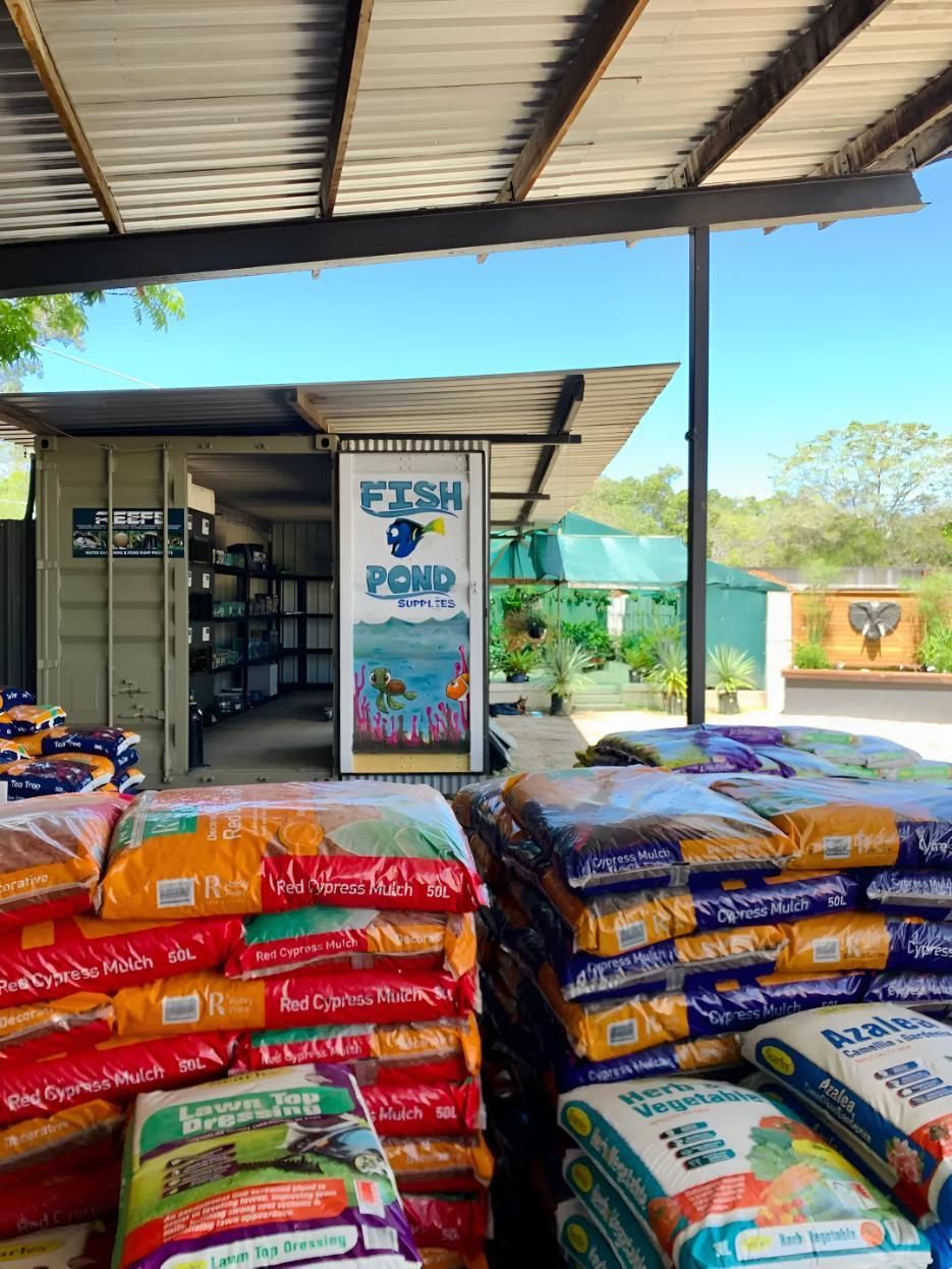A Bunch of Bags of Food Are Stacked on Top of Each Other in a Store — Black Rock Garden Centre In Tyagarah, NSW