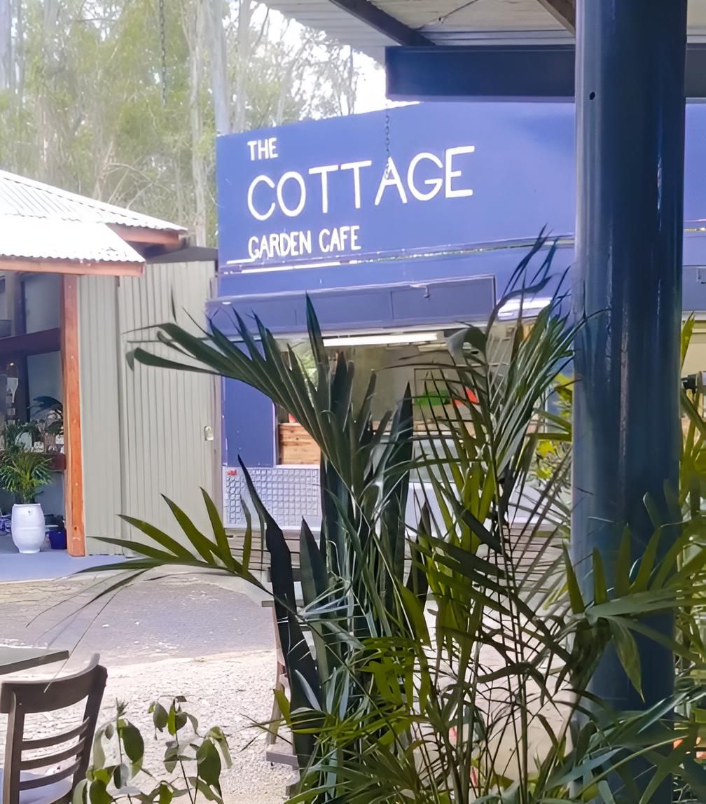 A Blue Sign for the Cottage Garden Cafe — Black Rock Garden Centre In Tyagarah, NSW