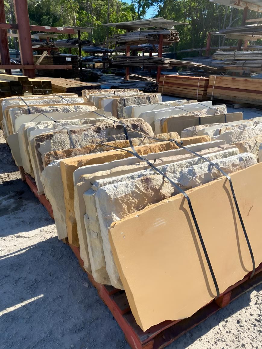 A Pallet of Rocks is Sitting on the Ground in a Yard — Black Rock Garden Centre In Tyagarah, NSW