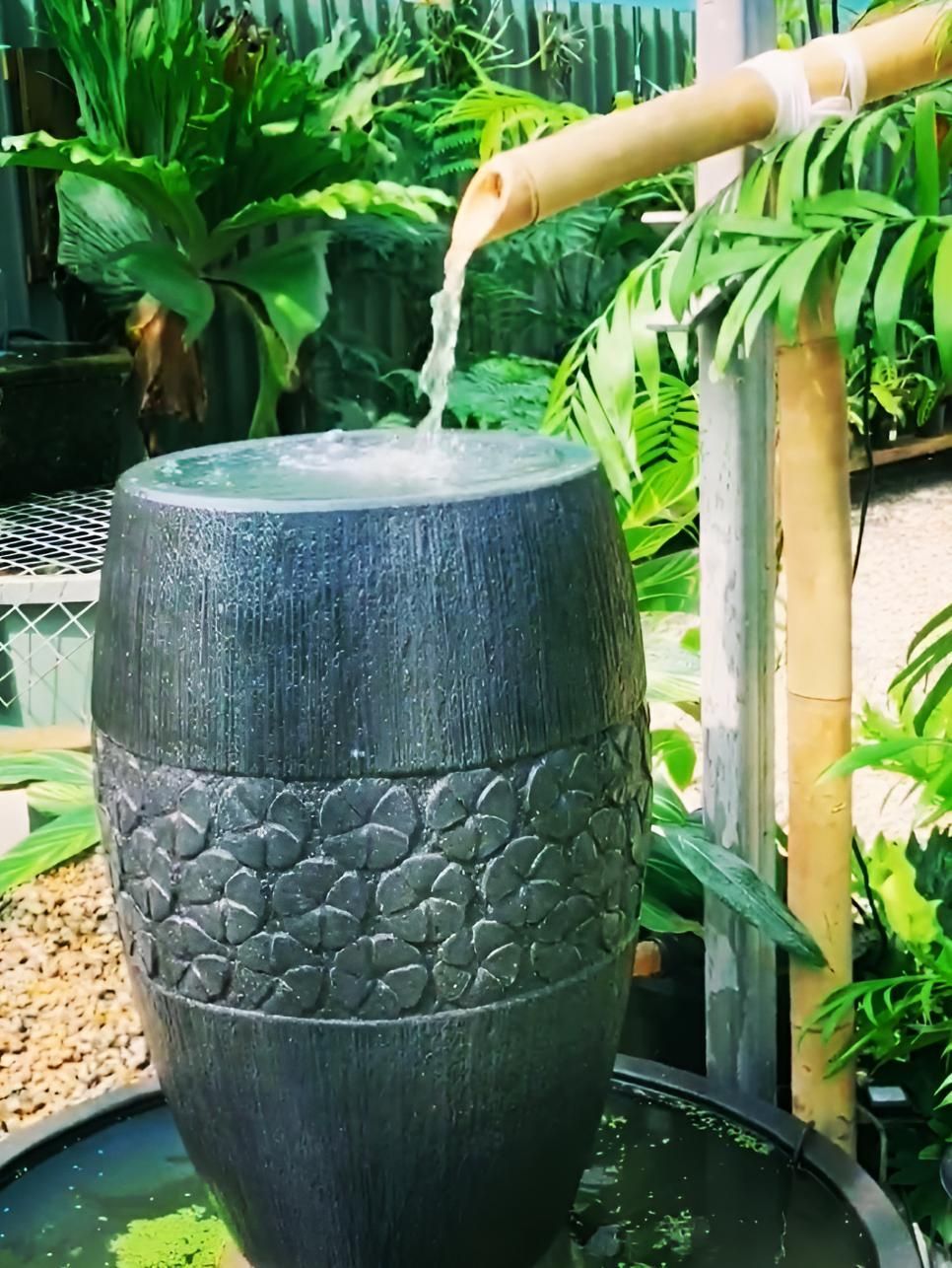 A Water Fountain With a Bamboo Pipe Coming Out of It — Black Rock Garden Centre In Tyagarah, NSW